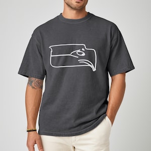 Championship winner t shirt featuring a Sam Darnold hand drawn logo shirt style graphic, Seattle football team meme shirt made for fans who appreciate funny Seattle sports t shirt designs, perfect gift for football fan shirt, unisex fit ideal for game day outfits, tailgates, watch parties, sports bars, casual wear, Seattle football fans, meme culture lovers, and bold sports themed apparel collectors