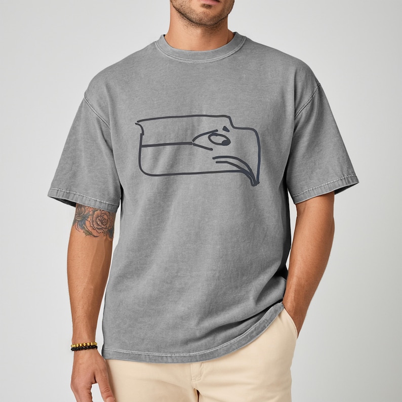 Sam Darnold hand drawn logo shirt featuring a Seattle football team meme design, funny Seattle sports t shirt made for passionate fans, championship winner t shirt with playful hand illustrated artwork, perfect gift for football fan shirt, unisex Seattle football apparel great for game day, tailgating, watch parties, sports bars, casual wear, football season outfits, and Seattle sports lovers looking for a bold meme style tee