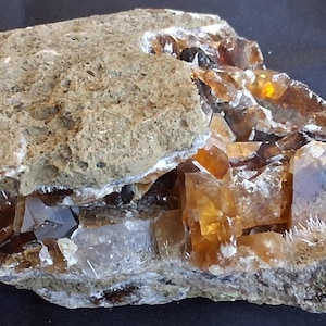 The Chameleon Stone: Reactive Ruby-Red Bastnaesites & Magnetic Volcanic Carbonatite