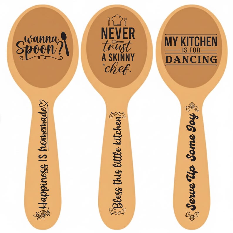 May include: Three wooden spoons with black text. One spoon says "wanna spoon?" and "Happiness is homemade". Another says "Never trust a skinny chef" and "Bless this little kitchen". The last says "My kitchen is for dancing" and "Serve up some joy".