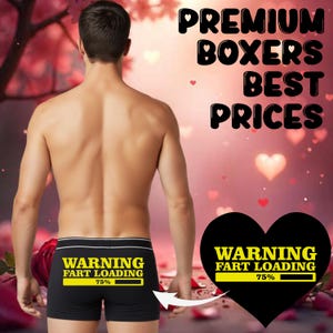 May include: Black boxer shorts with a white waistband. The shorts feature the text "WARNING FART LOADING 75%" on the back. The image also includes the text "PREMIUM BOXERS BEST PRICES".