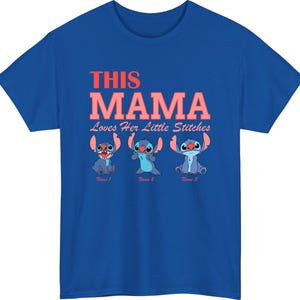 May include: Royal blue t-shirt featuring the text "THIS MAMA Loves Her Little Stitches" in red and pink. Below the text are three cartoon Stitch characters in different poses. The shirt is a crew neck and short-sleeved.