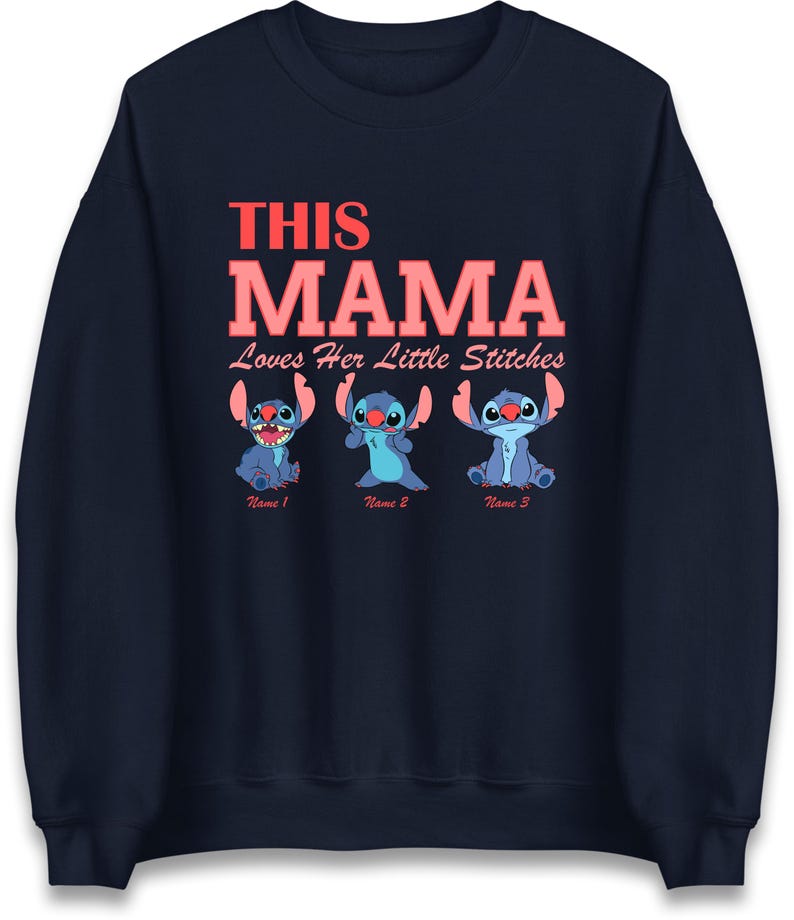 May include: Navy blue sweatshirt with the text "THIS MAMA Loves Her Little Stitches" in coral. Below the text are three blue cartoon characters. Each character has a name below it: Name 1, Name 2, and Name 3.