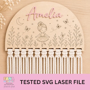 May include: A wooden wall hanging with a macrame design. The top is a half-circle with the name "Amelia" in pink. It features a ballerina illustration, butterflies, and floral details. The bottom has a macrame fringe. The text "TESTED SVG LASER FILE" is at the bottom.