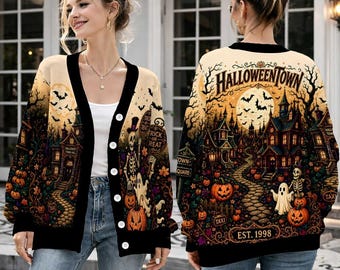 May include: A long-sleeve button-down cardigan featuring a Halloween-themed graphic print. The design displays a spooky town scene with a full moon, bats, ghosts, skeletons, pumpkins, and a stone path. The text reads HALLOWEENTOWN and EST. 1998.