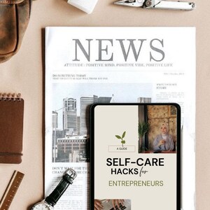 May include: An overhead shot features a newspaper with the headline "NEWS" and the text "SELF-CARE HACKS for ENTREPRENEURS" on a tablet. A watch, notebook, and tools are also visible, creating a workspace theme.