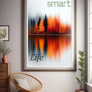 May include: A framed art print with a blurred landscape of orange, black, and grey trees reflected in water. The words "SMART" and "LIFE" are displayed on the print. The artwork is in a room with a chair and a potted plant.