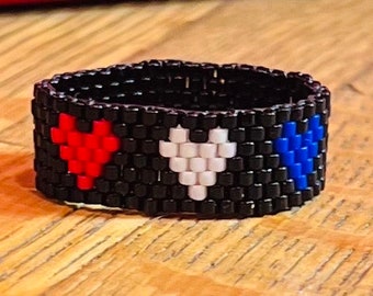 Red white and blue heart ring.  Size 8.  Please let me know if you need a different size.