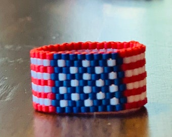 American Flag Beaded ring. Size 7.  Send a message if you need a different size.