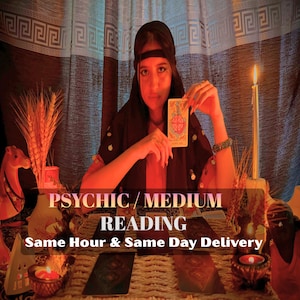 May include: A person holding a tarot card with a Wheel of Fortune design. The image features text that reads "PSYCHIC / MEDIUM READING" and "Same Hour & Same Day Delivery". The scene includes candles, decorative items, and a patterned curtain.