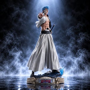 May include: A detailed anime character figurine featuring a figure with spiky blue hair, a skeletal jaw mask, and a muscular torso. The character wears a white open jacket and long white hakama trousers, standing on a base labelled Bleach Tite Kubo.