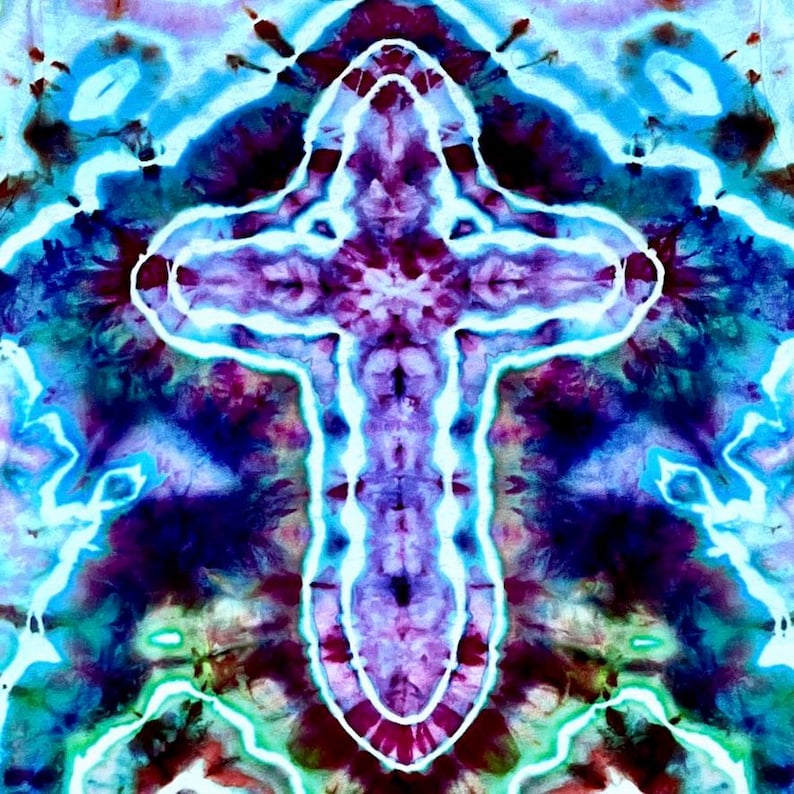 May include: A fabric textile featuring a tie-dye pattern with a central cross shape. The design displays vibrant shades of deep purple, magenta, and dark blue, contrasted by bright white lines that outline the cross and create intricate, symmetrical patterns throughout the surface.