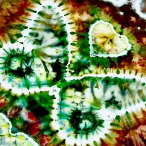 May include: Abstract tie-dye pattern in shades of green, brown, and white. The design features swirling patterns and a heart shape, creating a colorful and artistic visual.