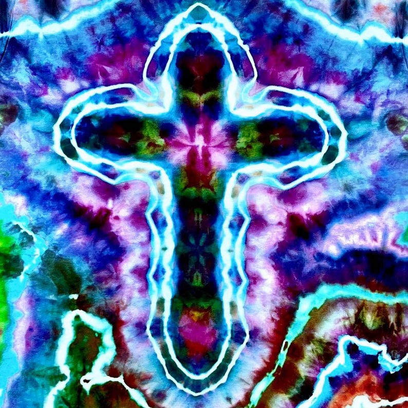 May include: A colourful tie-dye design with a glowing, white-outlined cross at the centre. The background is a swirling mix of blues, purples, greens, and reds, creating a psychedelic effect. The artwork has a spiritual or artistic theme.