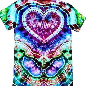 May include: A short-sleeve t-shirt featuring a vibrant tie-dye pattern with a prominent central heart shape. The design incorporates swirling colors of deep purple, magenta, bright turquoise, lime green, and white, creating a complex, symmetrical effect.