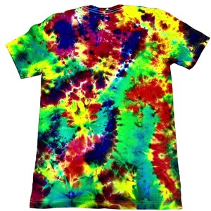 May include: A short-sleeved t-shirt with a vibrant tie-dye pattern. The shirt features a blend of colors, including yellow, green, red, and blue, creating a psychedelic effect. The t-shirt is made of a soft material and has a classic crew neck.