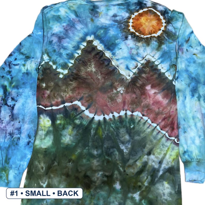 May include: A long-sleeve tie-dye shirt featuring a mountain landscape design in shades of blue, green, brown, and red, with a circular orange sun in the upper right corner. The text #1 &bull; SMALL &bull; BACK is printed in the bottom left corner.