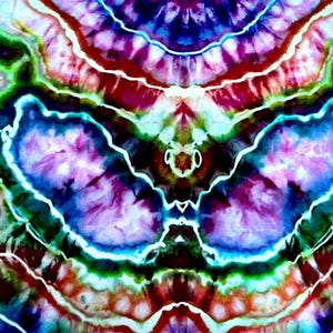 May include: A tie-dye fabric featuring a symmetrical, kaleidoscopic pattern with vibrant shades of purple, blue, red, and green. The design is defined by sharp, white, organic lines that create distinct, flowing shapes across the surface.