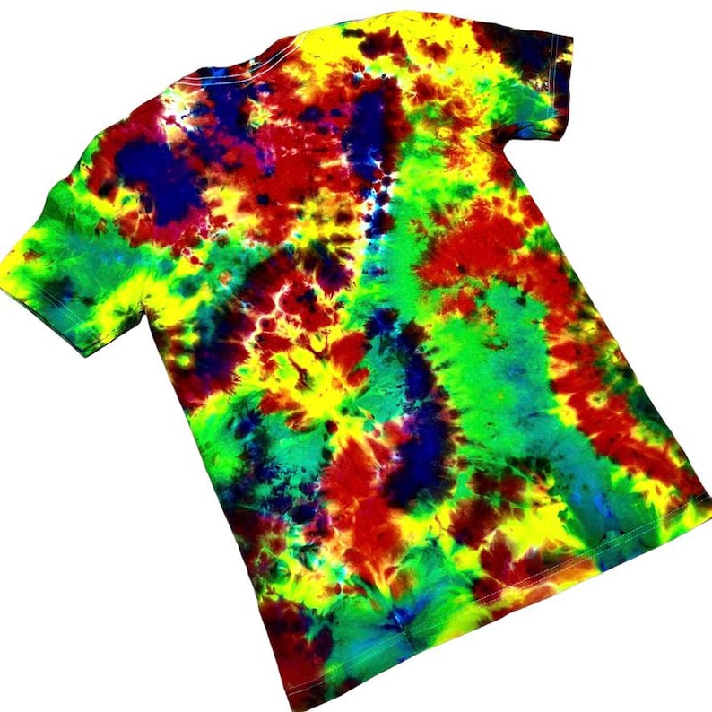 May include: A tie-dye t-shirt with a vibrant mix of colors. The shirt features a swirling pattern of yellow, red, green, and blue hues. The short-sleeved tee is made of a soft material and is suitable for casual wear.