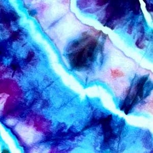 May include: Abstract tie-dye pattern in shades of blue, purple, and white. The design features a blend of colours with a watercolour effect, creating a dynamic and textured appearance. The pattern is suitable for fabric or surface design.