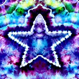 May include: A vibrant tie-dye design featuring a large white outlined star against a backdrop of swirling blues, purples, greens, and yellows. The fabric has a psychedelic, artistic appearance, with a blend of colors creating a unique pattern. The overall effect is visually striking.