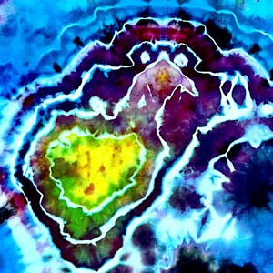 May include: Abstract tie-dye design with a heart-shaped center. The artwork features a vibrant color palette of yellow, green, purple, and blue, with white outlining the shapes. The design has a psychedelic and artistic feel.