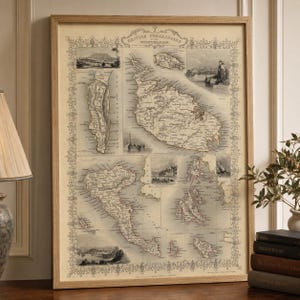 May include: A framed vintage-style map titled British Possessions in the Mediterranean, featuring detailed cartography of various islands, coastal regions, and small inset illustrations of harbors and landscapes in sepia and cream tones.