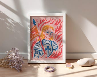 May include: Framed art print featuring a stylized illustration of a woman holding a flag, set against a backdrop of red flames. The artwork is in a white frame and has a pink background. The woman is depicted with blonde hair and blue armor.