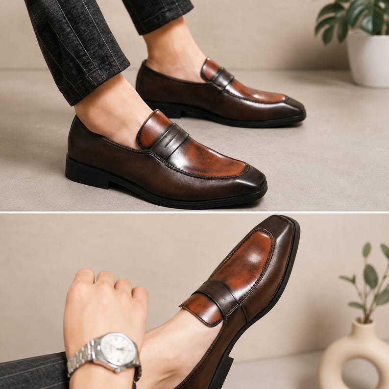 May include: A pair of brown leather penny loafers featuring a polished finish with darker burnished edges, a square toe, a classic saddle strap across the vamp, and a low black heel, shown from both a side profile and an angled perspective.