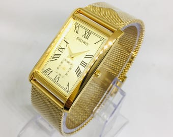 Reloj de pulsera vintage Seiko Tank Side Second: esfera romana dorada, correa de acero inoxidable dorada