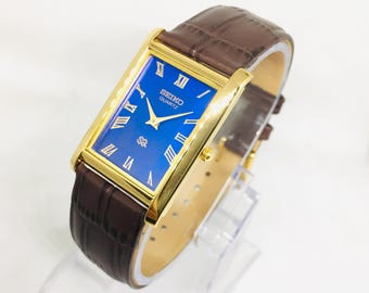 Reloj de pulsera Seiko Tank vintage: esfera azul, correa de cuero marrón
