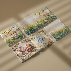 May include: A square children's book titled First Book of Prayers for Emma, featuring illustrations of a lamb, a mouse, and a robin in a field of flowers. The book is shown in multiple views, including the cover and an open page with text.