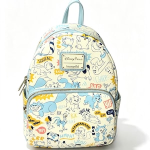 May include: A cream-coloured mini backpack featuring an all-over print of various Disney animal characters in blue, yellow, and black. The bag includes a front zipped pocket, a top handle, and a metal Disney Parks Loungefly logo plaque on the front.