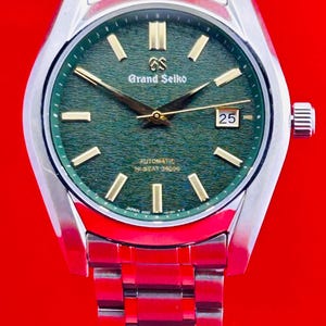 Vintage Grand Seiko Evolution 9-serie herenhorloge met groene wijzerplaat en datum