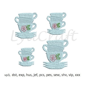 May include: Three sets of blue and white teacups with pink and green floral designs. The teacups are stacked on top of each other and are on a white background.