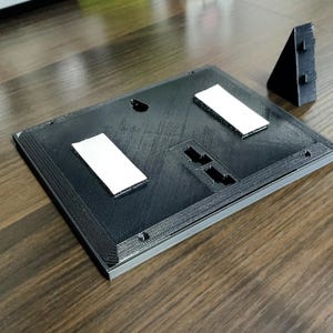 Rear mounting plate with the removable desk stand detached.