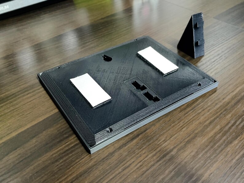 Rear mounting plate with the removable desk stand detached.