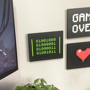 HACK Binary, Game Over and Pixel Heart plaques mounted together; each design sold separately.