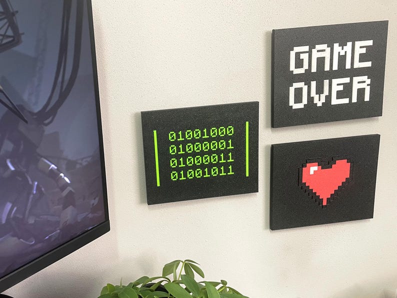 HACK Binary, Game Over and Pixel Heart plaques mounted together; each design sold separately.