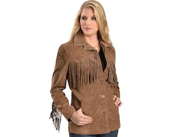 May include: A brown suede jacket with fringe detailing across the chest, sleeves, and back. The jacket has a button-up front, a collar, and pockets. The model is wearing blue jeans. The jacket is a western-inspired style.