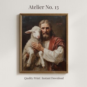 Könnte beinhalten: Ein gerahmter Druck eines religiösen Gemäldes. Das Kunstwerk zeigt einen Mann mit Bart, der ein Lamm hält. Der Mann trägt ein weißes Gewand mit einem roten Schal. Der Rahmen ist goldfarben. Der Text "Atelier No. 13" und "Quality Print | Instant Download" sind sichtbar.