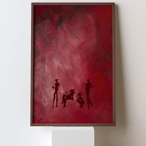 May include: A framed abstract painting with a deep red background and dark silhouettes of figures. The figures are in various poses, suggesting a social gathering. The frame is a dark wood. The artwork is displayed on a white pedestal.