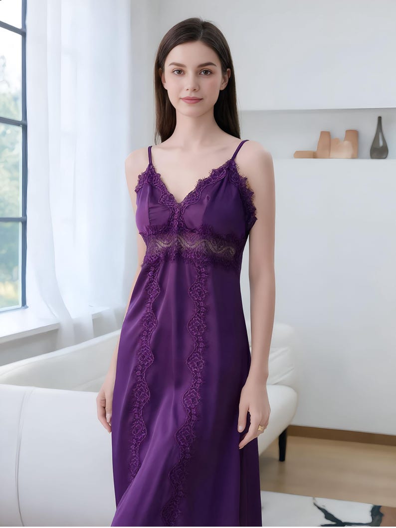 May include: A deep purple satin nightgown with delicate lace trim. The nightgown features a V-neckline and lace detailing along the bodice and hem. The straps are thin and adjustable. The overall design is elegant and feminine.