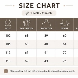 May include: A brown and white size chart table with the text SIZE CHART and 1 INCH = 2.54 CM. It lists sizes S, M, L, and XL with corresponding measurements in centimetres for bust, top length, shoulder, waist, and pants length. Includes a note.