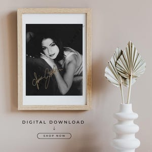 May include: Black and white framed photograph of a woman with a signature. The photograph is in a light wood frame. The text "DIGITAL DOWNLOAD" and "SHOP NOW" are below the frame.