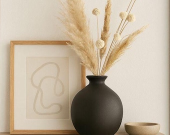 Matte, schwarze, abgerundete Keramikvase, nordisch-minimalistisches Wohnaccessoire