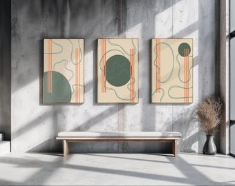 May include: Three framed abstract art prints. Each print features a beige background with teal and orange geometric shapes. The artwork is displayed on a concrete wall above a wooden bench. A vase with dried plants sits nearby.