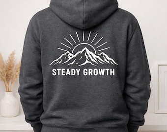 Steady Growth Mountain-hoodie, minimalistisch natuursweater, motiverende grafische print op de achterkant
