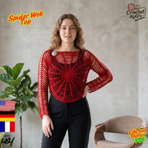 May include: A red long-sleeve crochet top featuring a spider web pattern, a boat neckline, and a circular design radiating from the center. The text Spider Web Top and Crochet ByGfx are visible. The garment is worn over a black base layer.