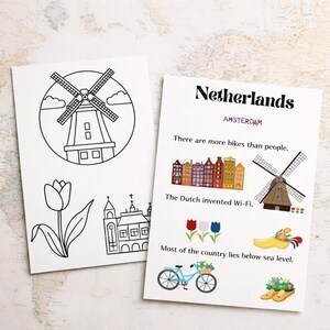 May include: Two white cards with illustrations and text about the Netherlands. One card features a windmill, tulip, and church outline. The other card says "Netherlands" and "Amsterdam" with facts and images of bikes, windmills, and clogs.